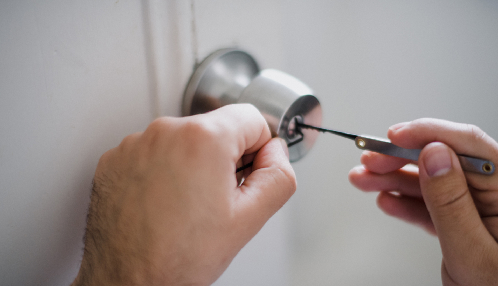 Midnight Locksmiths & Security | 24 Hour Emergency Locksmith West Ryde, Sydney Image of Locksmith Gaining Entry To Locked Out House - Midnight Locksmiths & Security | 24 Hour Emergency Locksmith West Ryde, Sydney
